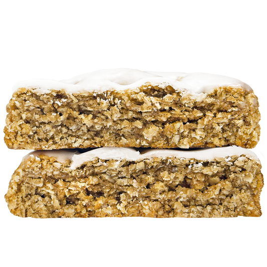 An oatmeal cookie with an off white icing on top
